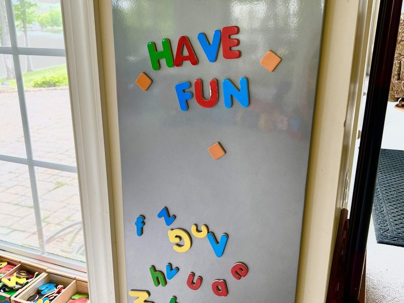 The kids have such a blast down here! The playroom has blocks, books, puzzles, race car tracks, and a fun magnet board!