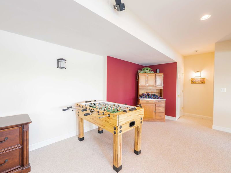 Foosball table and an arts and crafts area in the corner! You can find lots of crayons, coloring books and activity books in the drawers!
