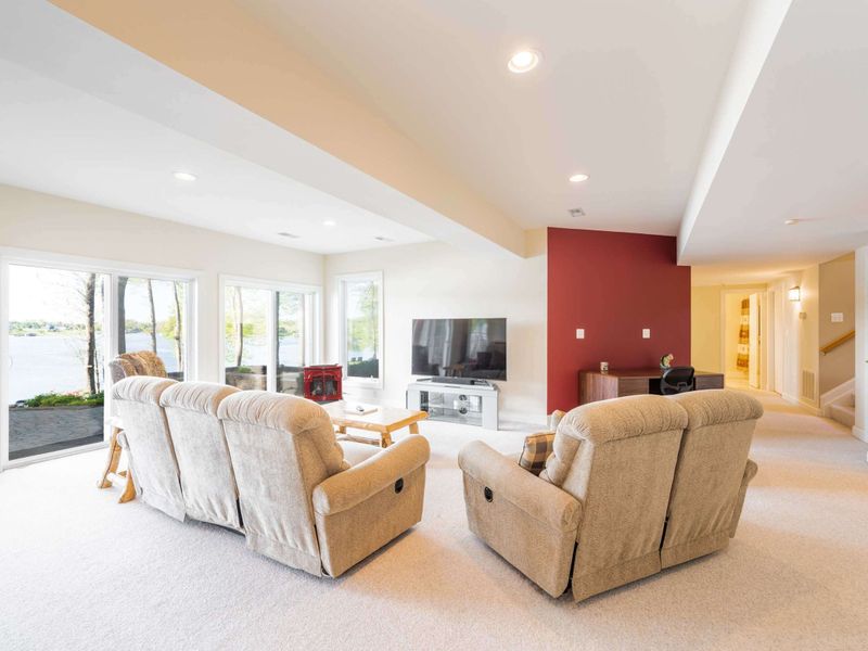 The basement living area with super comfortable, recliners and TV with surround sound. Easy access to the backyard.