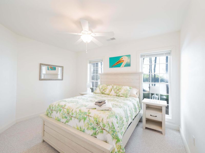 The pelican room in the basement! Comfortable bedding, lake views and full bath right outside your door!