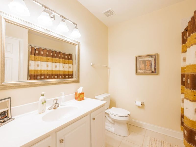 The full bath in the basement between the Queen bedrooms. Right near the bunk room. Has a bath for kids!
