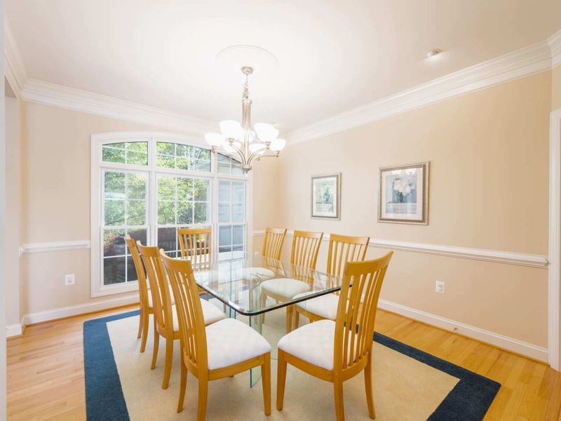 Our formal dining room is located right near the kitchen. The perfect spot for a nice, family dinner in these comfortable, cushioned dining chairs.