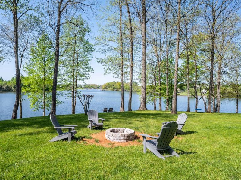 Fire pit for non fire and s’mores!! We love telling stories and sitting by the fire at night! Just steps away from the hot tub and of course, lake views