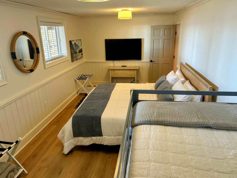 Bedroom 5 – A king bed, bunk beds, charming decor, and lake views make this a perfect retreat for families or groups!