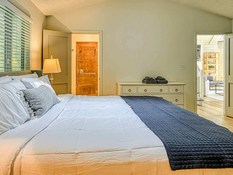 Primary Suite Bedroom: A bright and airy bedroom for ultimate relaxation near Lake Anna.