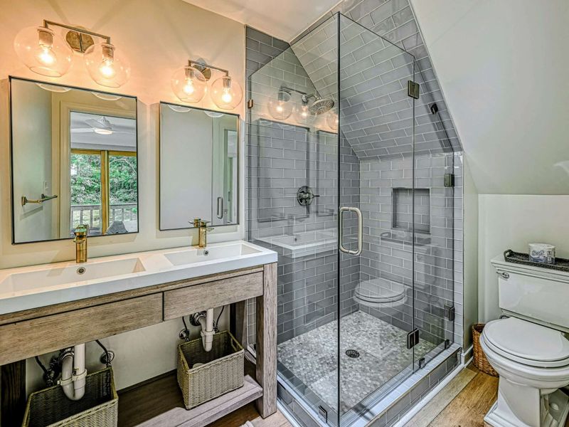 Attached Loft Bathroom: Modern fixtures in a private bathroom near the Lake Anna retreat.
