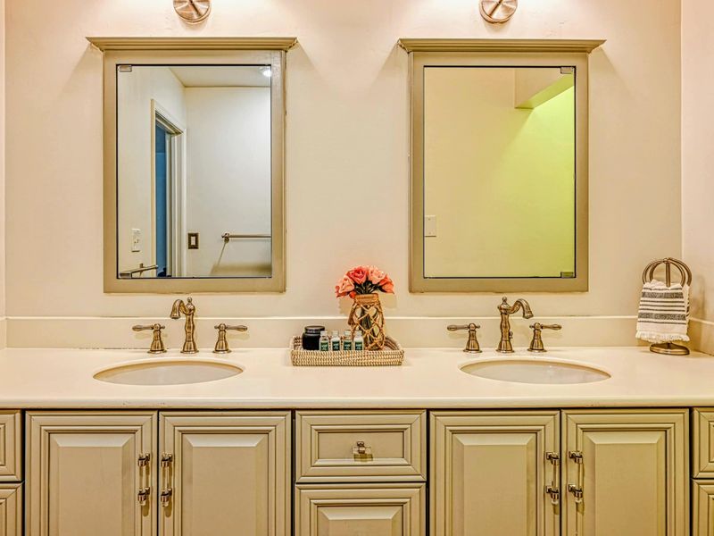 Attached Primary Bathroom: Modern fixtures in a private bathroom near the Lake Anna retreat.