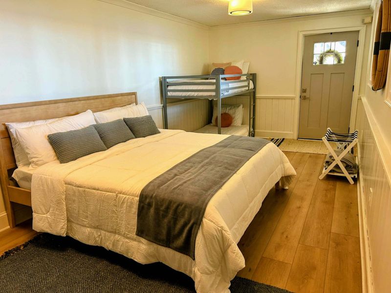 Bedroom 5 – A king bed, bunk beds, charming decor, and lake views make this a perfect retreat for families or groups!
