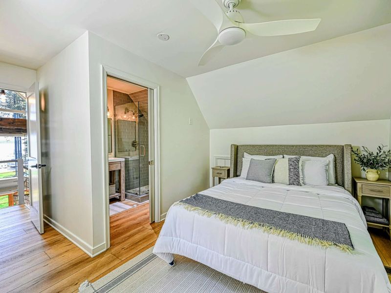 Loft Bedroom Suite: A bright loft bedroom with attached bathroom, ample natural light and a private balcony.