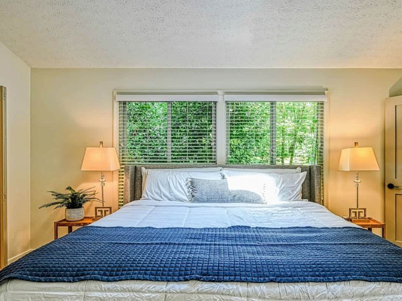 Primary Suite Bedroom: A bright and airy bedroom for ultimate relaxation near Lake Anna.