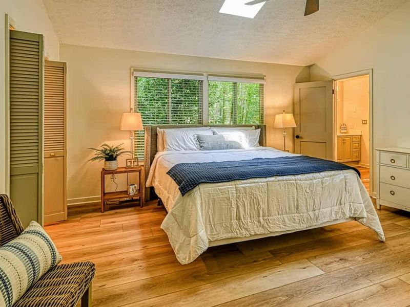 Primary Suite Bedroom: A bright and airy bedroom for ultimate relaxation near Lake Anna.