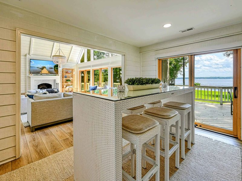 Modern Living Room: A cozy indoor corner with bright, open views of Lake Anna.