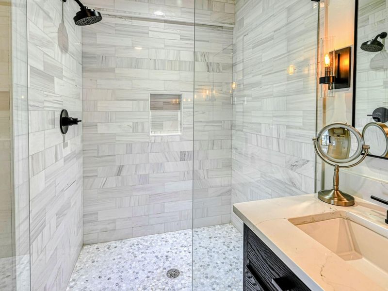 Attached Lakeview Bathroom: Modern fixtures in a private bathroom near the Lake Anna retreat.