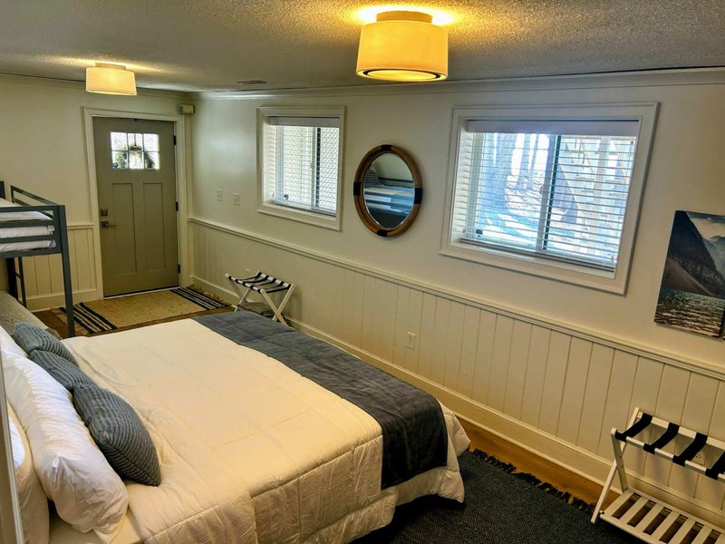Bedroom 5 – A king bed, bunk beds, charming decor, and lake views make this a perfect retreat for families or groups!