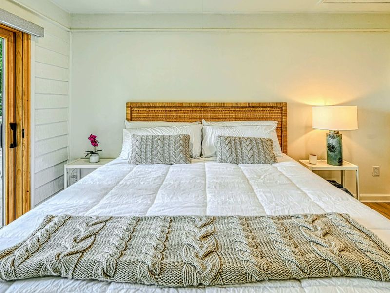 Lakeview Bedroom Suite: A spacious bedroom suite with calming views of Lake Anna and minimalist décor.