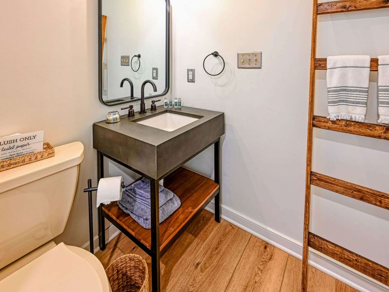 Shared Bathroom: A clean and spacious bathroom, perfect for family use during your Lake Anna getaway.