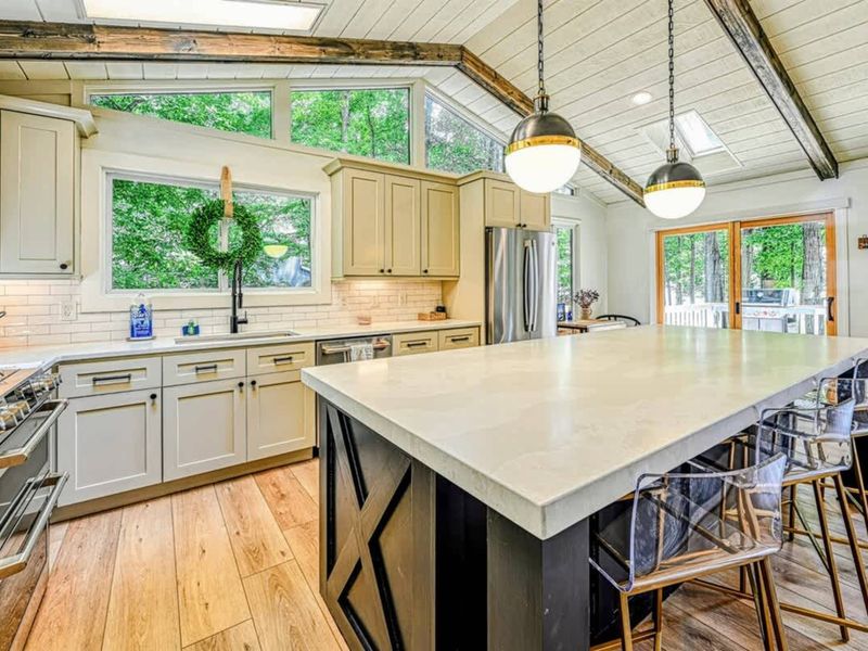 Modern Kitchen: A spacious kitchen with sleek countertops and views of Lake Anna.