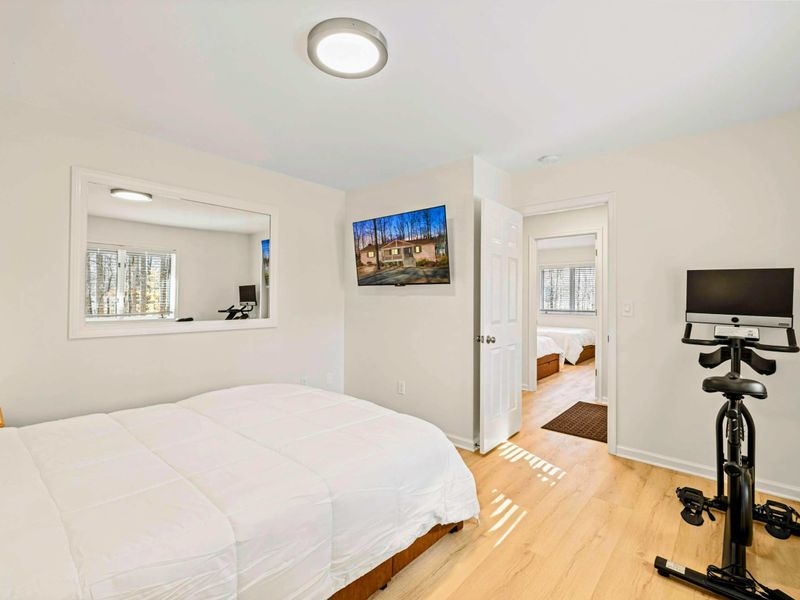 Cozy & Elegant – A tranquil bedroom with soft linens and warm lighting.