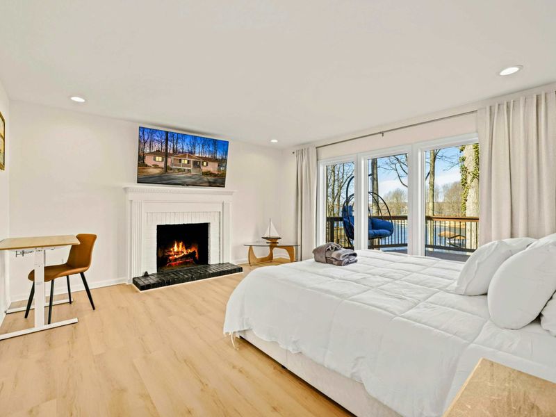 Primary Suite Retreat – Wake up to breathtaking lake views.
