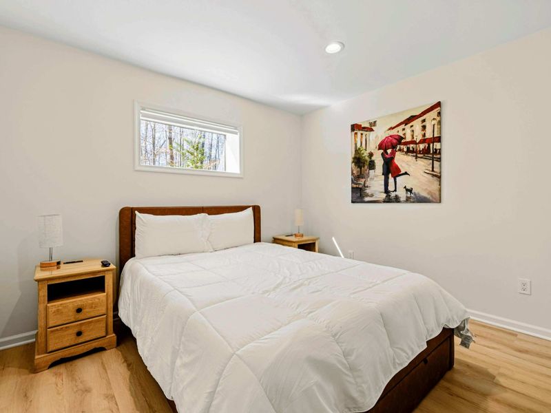 Cozy & Elegant – A tranquil bedroom with soft linens and warm lighting.