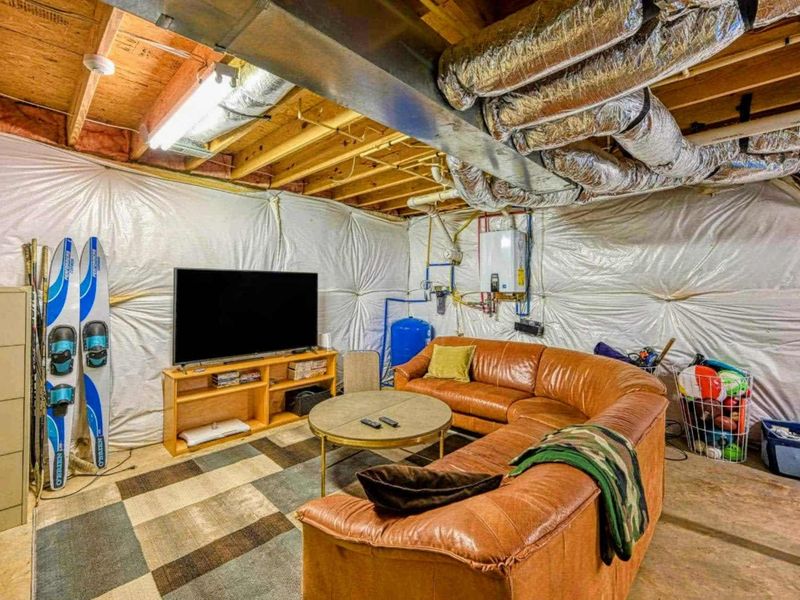 Unwind in our cozy basement lounge, complete with a large TV for movie nights and a comfortable seating area.