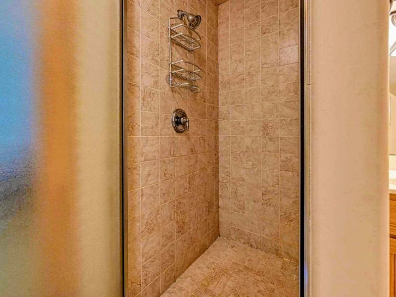 Step into our spacious tiled shower and indulge in a refreshing, spa-like experience.