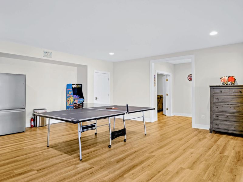 Game Room - Ping pong, arcade, and a beverage fridge in one room, the unofficial clubhouse for everyone under 18 and over 40.