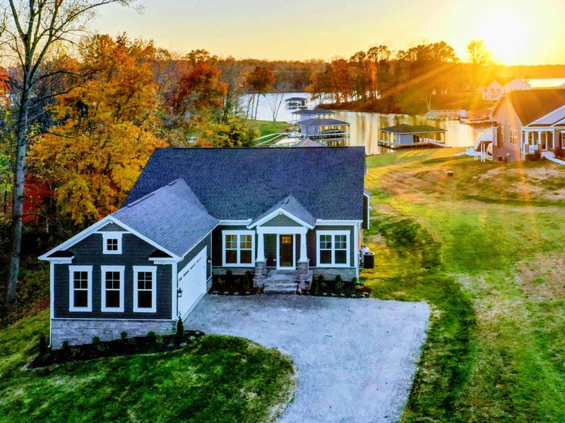Lakefront Living - Long sunsets, a private dock for the boat, and the calm of the cove just steps from the door.