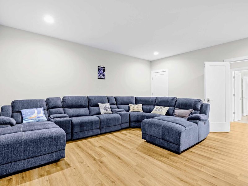 Theater - U-shaped sectional with chaise ends and a Lake House pillow, the calmest room in the house for family movie nights.