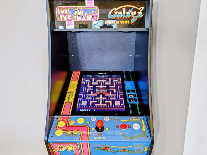 Game Room - Close-up of the Ms. Pac-Man and Galaga arcade, the room's first-day favorite for kids and the kids at heart.