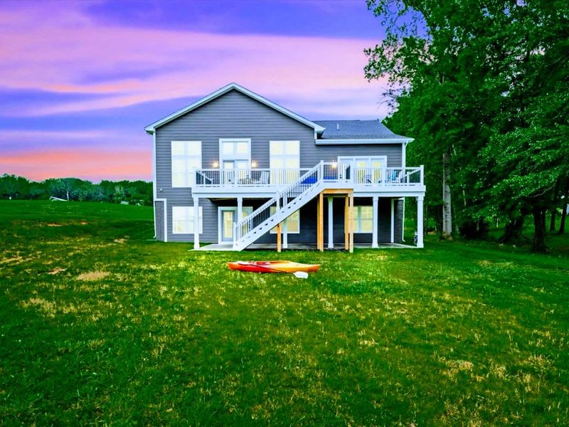 Sunset Side - Western-facing porches and decks catch the golden hour as the lake quiets down for the evening.