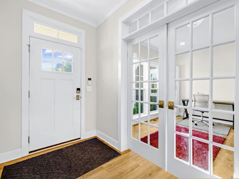 Office - French glass doors open to a quiet work space with desk and chair, perfect for remote work between lake days.