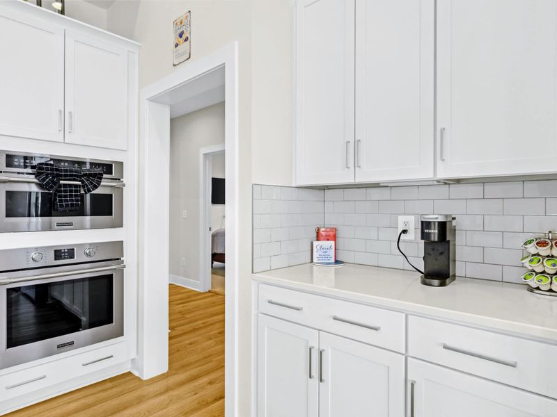 Kitchen - Coffee station with Keurig and built-in convection oven, set up so early risers can stay quiet and caffeinated.