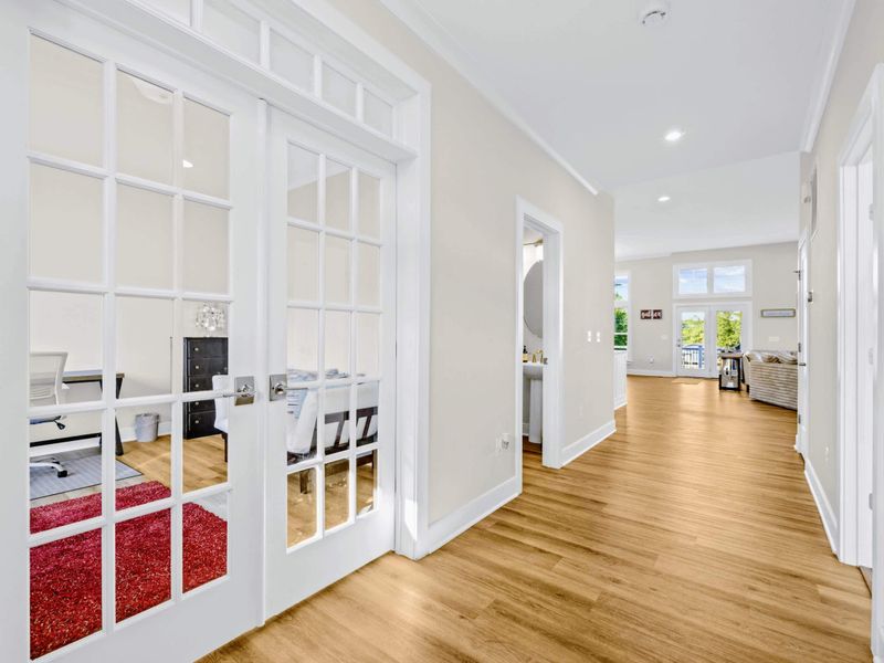 Office - View from the front entry hallway looking back through the glass French doors into the office and great room.
