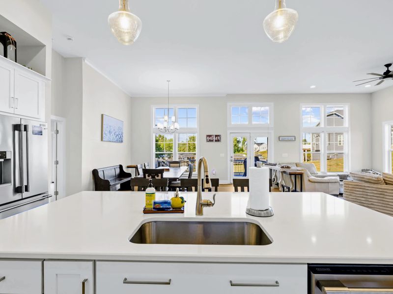 Kitchen - The island sink looks straight across the great room sectional to the windows, so the cook is always in the room.