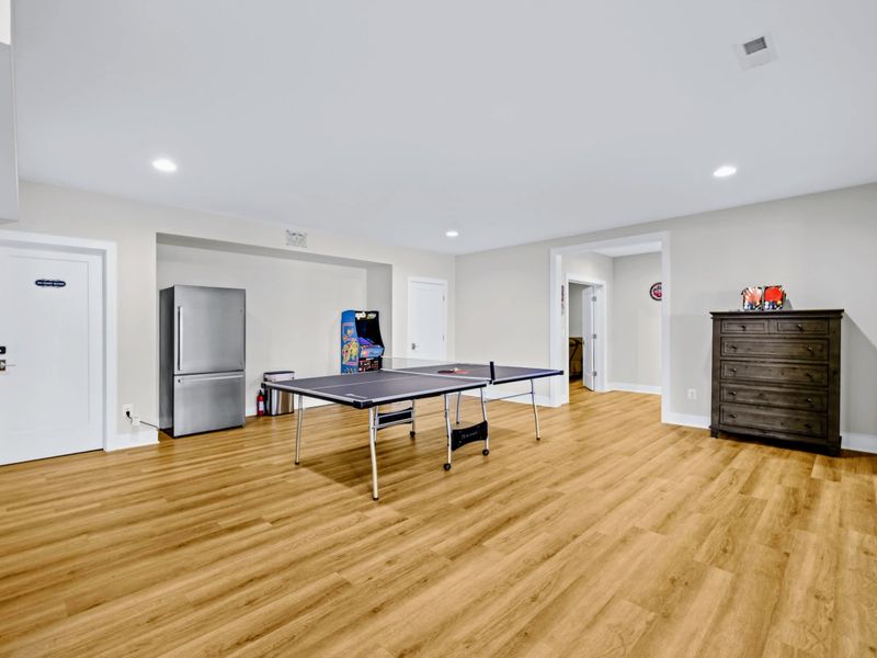Game Room - Full-size ping pong table and a classic Ms. Pac-Man and Galaga arcade headline the lake-level fun zone.