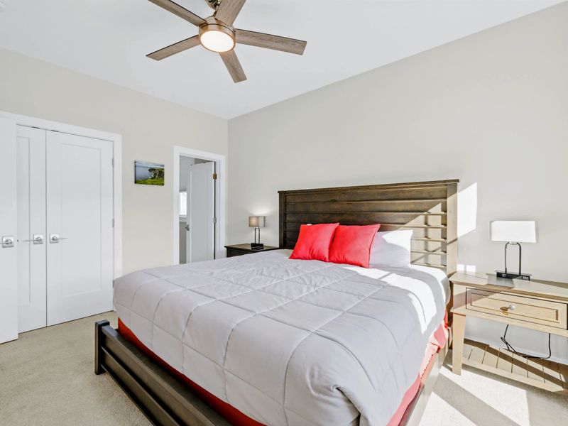 Suite 2 - King bed with double closets and a doorway straight to the ensuite bath, set up for an easy stay.