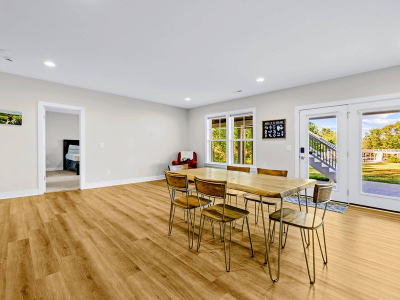 Game Room - The six-seat table sits beside the patio doors, with a bedroom and game alcove right off the main space.
