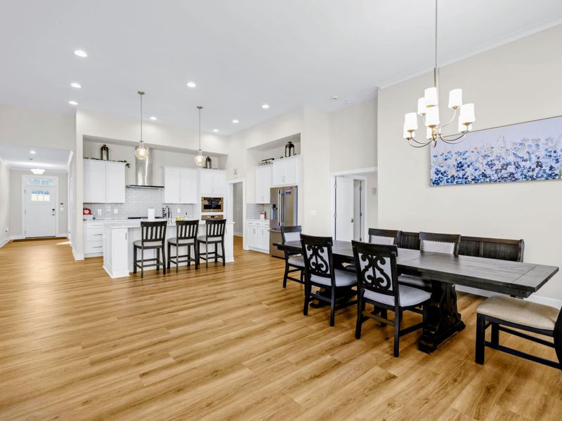 Dining Area - Long extended table seats eight just steps from the kitchen island, keeping the cook in on every conversation.