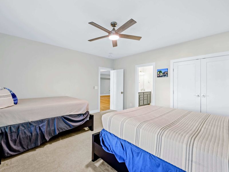 Suite 4 - Two queen beds with shared ensuite bath access and double closets, ample group storage for an active week.