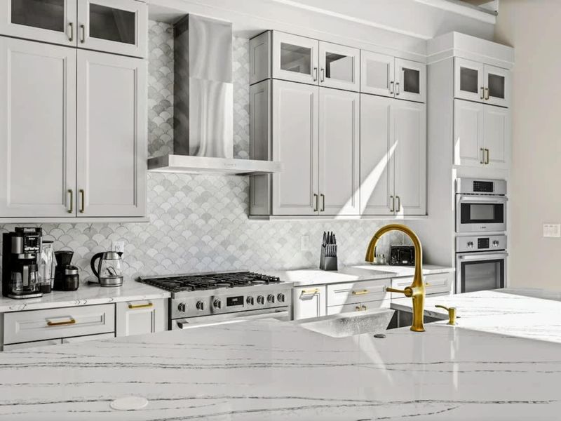 Luxury Kitchen: Thoughtfully designed with quartz countertops, a high-end gas range, custom cabinetry, a stylish backsplash, and a sleek gold faucet, blending elegance with functionality.