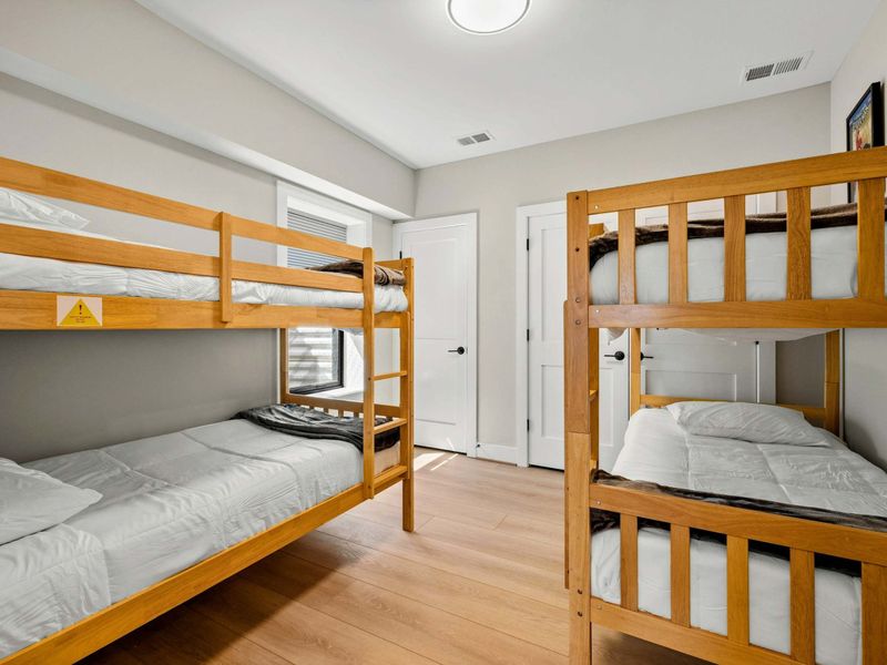 Suite #8: Features two sturdy wooden bunk beds, providing a cozy and functional sleeping space. This suite is designed for comfort and convenience, making it a great option for larger groups or families.