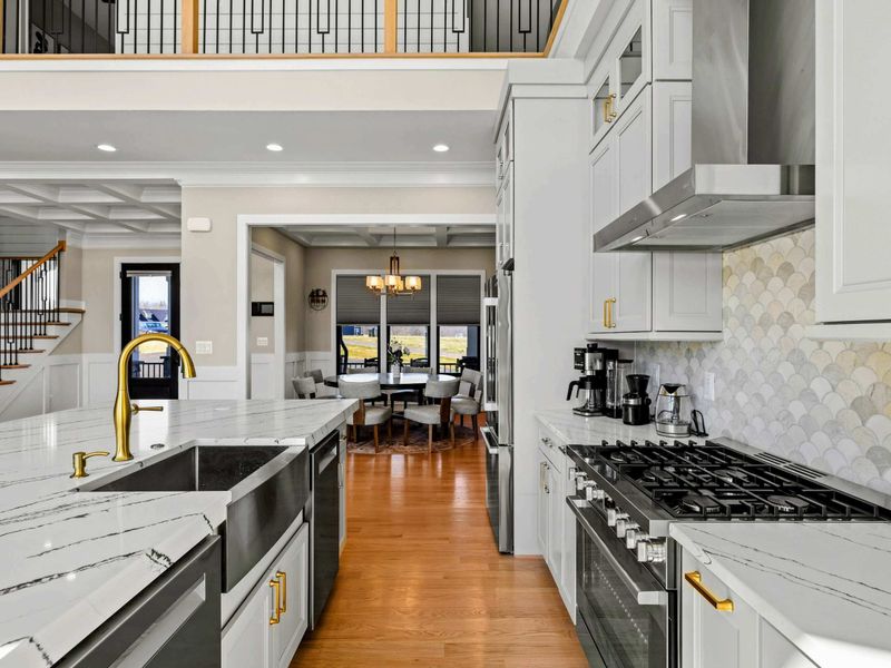 Luxury Kitchen & Dining Flow: This beautifully designed kitchen features a spacious quartz island, high-end appliances, and elegant finishes, seamlessly leading into the dining area for effortless entertaining.