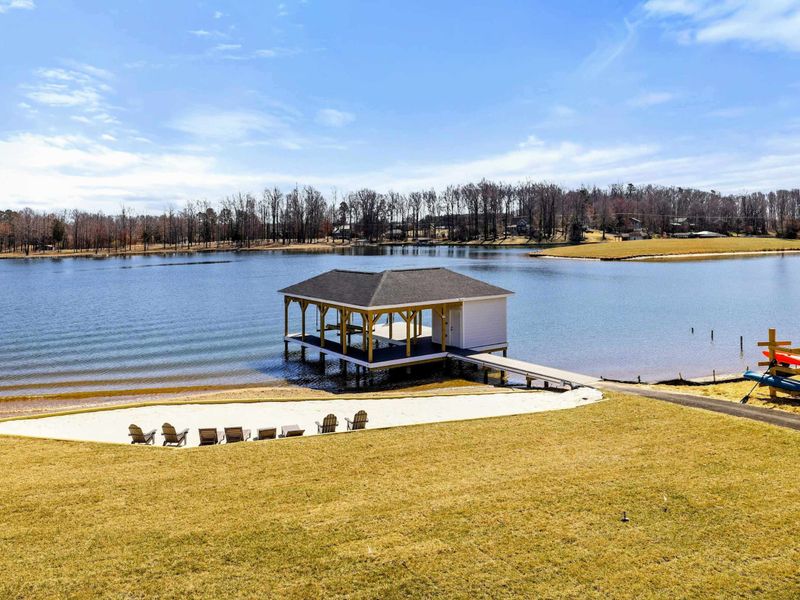 Private Waterfront: Relax on your private sandy beach or gather at the dockside seating area, taking in peaceful, uninterrupted views of serene Lake Anna.