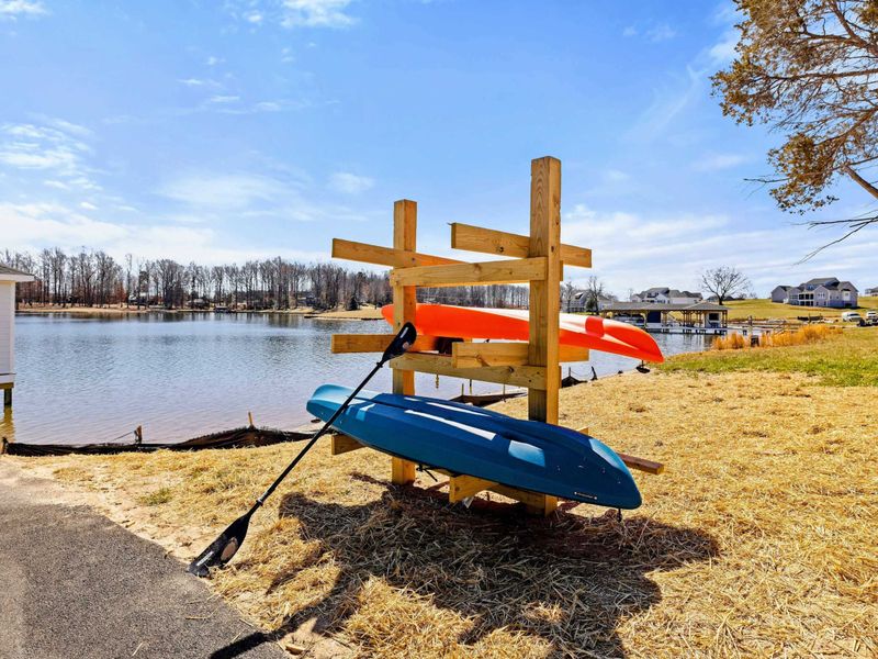 Kayak Station: Convenient lakeside rack with complimentary kayaks and paddles, ready for guests to embark on exciting Lake Anna adventures.