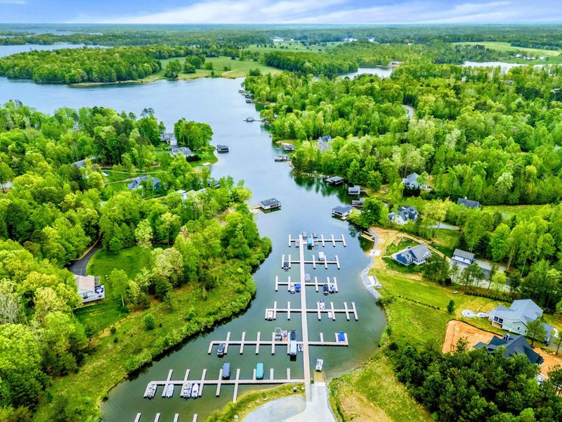 Aerial Setting - Coves, docks, and tree-lined shoreline frame the home's spot on the quiet, private side of Lake Anna.