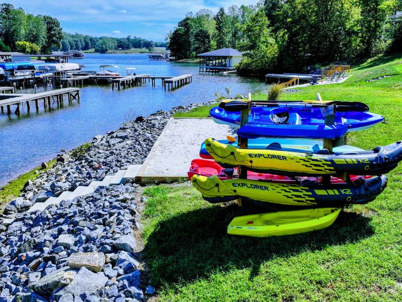 Backyard & Beach - Your kayak fleet lines the rocky shoreline, blue water and the quiet cove waiting the moment the coffee is done.