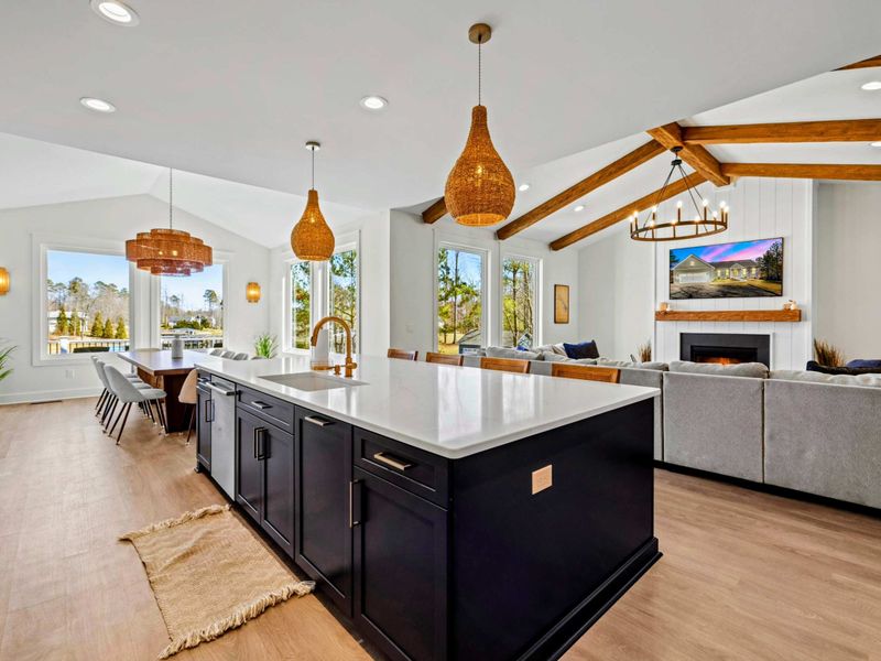 Open Floor Plan - Kitchen, dining, and great room share one vaulted, light-filled space, with large windows tracking the lake all day long.
