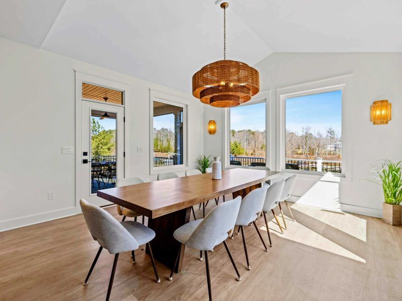 Formal Dining - Walls of windows and a glass door to the deck flood the dining room with natural light and frame the water just beyond.  (now with 12 seats!)