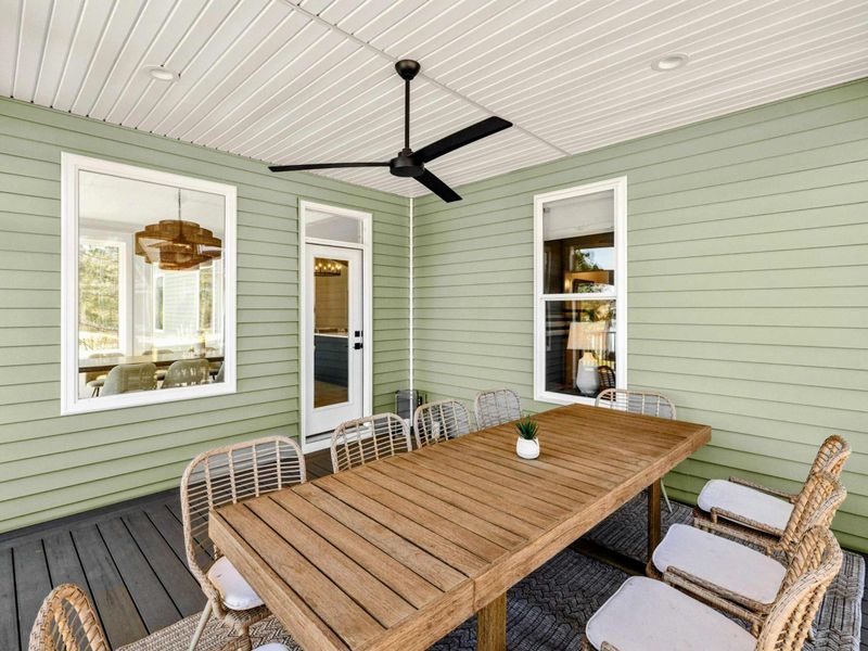 Screened Porch Dining - A long teak table under a ceiling fan turns lakeside dinners into the easiest, breeziest part of the day.